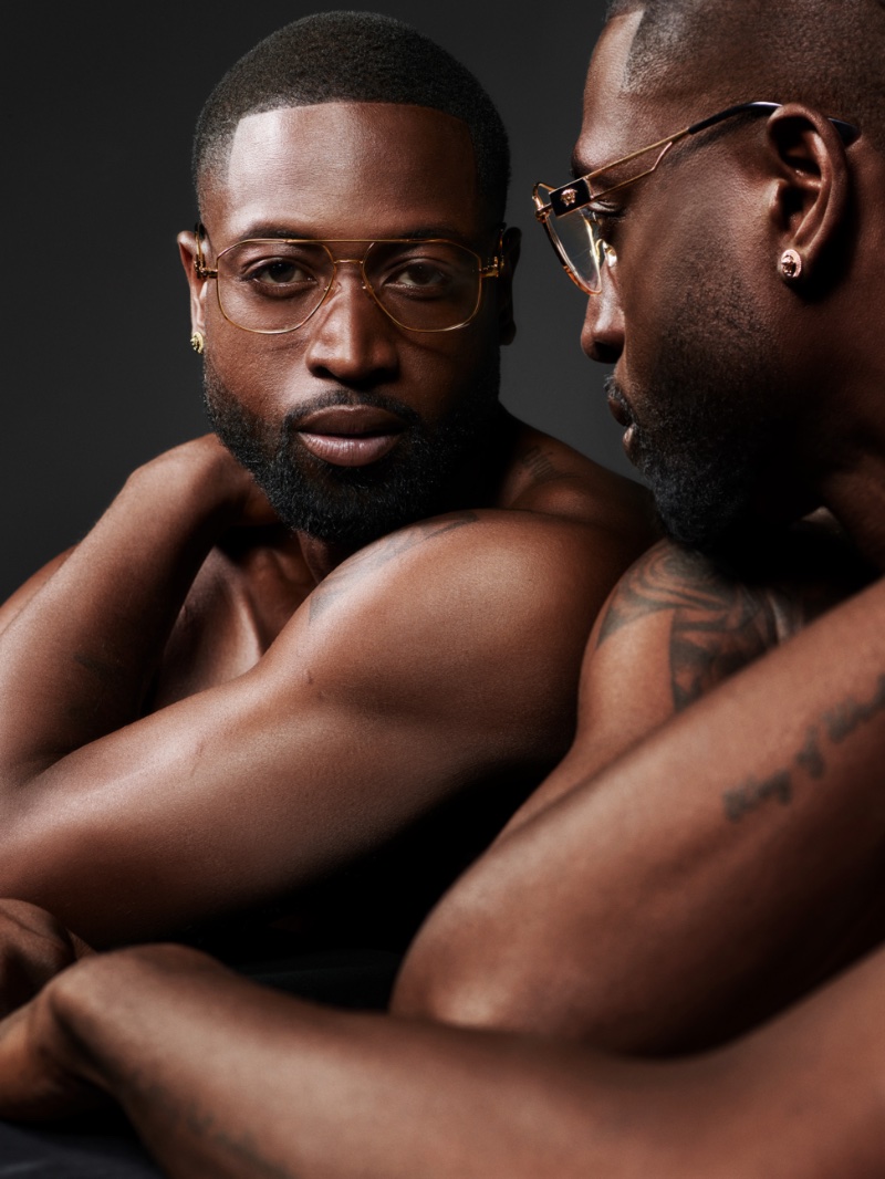 Dwyane Wade stars in Versace's spring 2023 eyewear campaign. The former professional basketball player sports the brand's gold VE1287 eyeglasses.