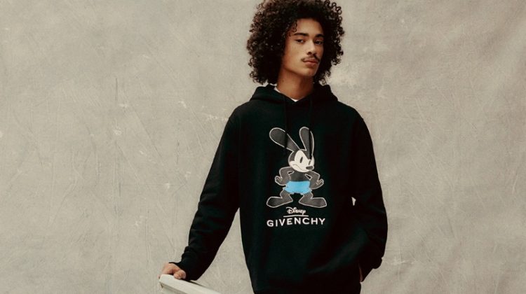 Dressed in all-black, Lucian Príeto-Sánchez sports a Givenchy x Disney look.