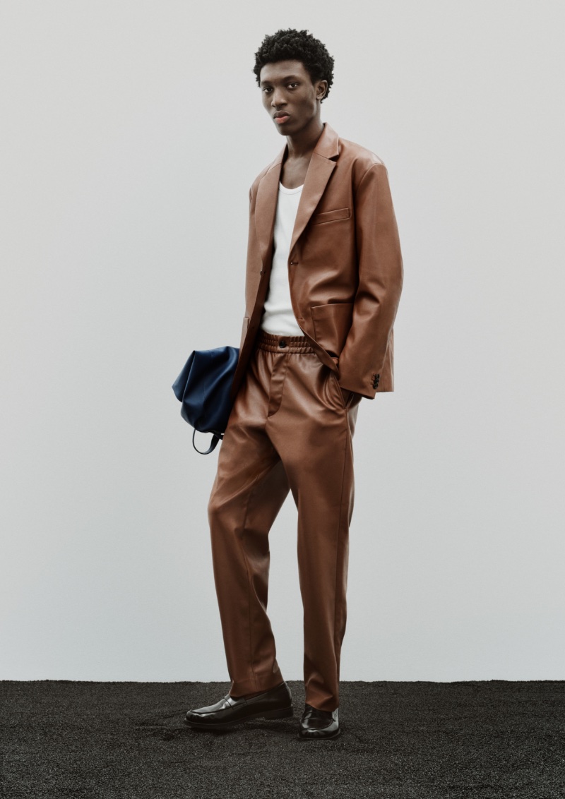 Ottawa Kwami models spring tailoring from H&M in a brown leather number. 