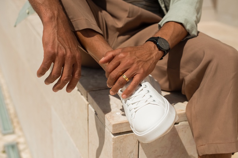 A man wears a gold wedding band on his left ring finger. » Breaking with Tradition: How Men Are Wearing Their Wedding Rings A man wears a gold wedding band on his left ring finger.