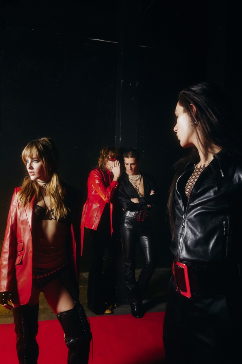 Rocking red and black, Måneskin wears Gucci leather fashions for their GOSSIP music video. Photo: Ilaria Ieie / Gucci