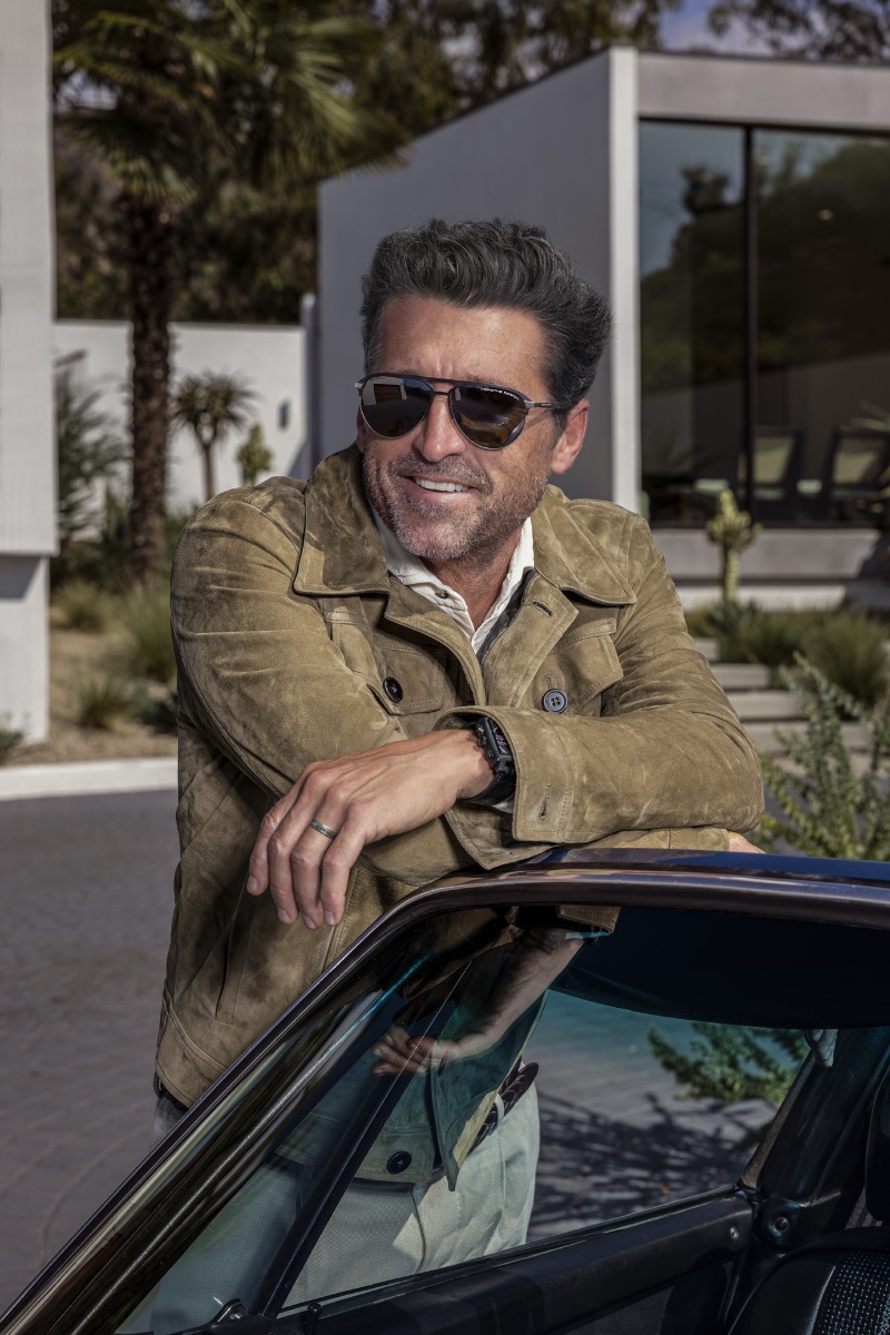 Sporting a suede jacket, Patrick Dempsey is all smiles in a pair of aviator-style sunglasses from his new Porsche Design collaboration.