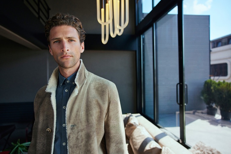 Taking the spotlight for Ramsey, Fabrizio Silva inspires in a tailored shearling jacket with a smart button-down shirt. 