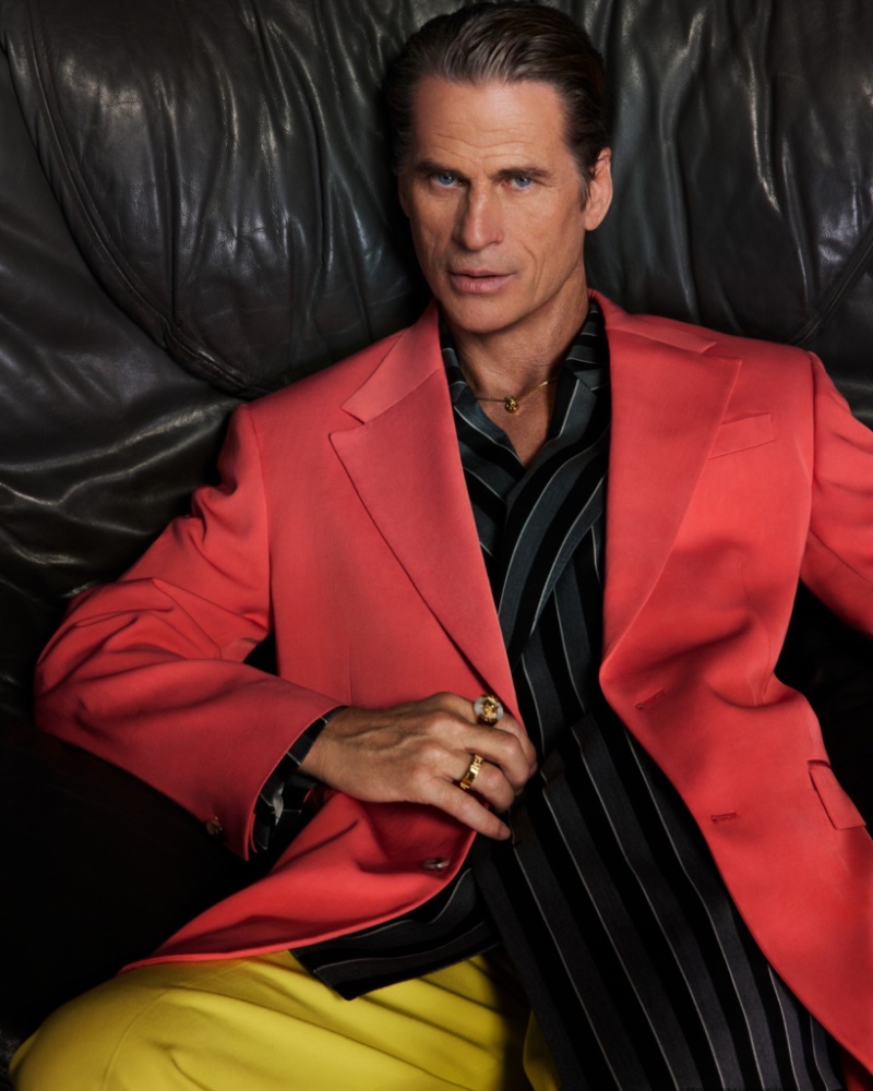 Mark Vanderloo commands attention in colorful tailoring for Versace's spring-summer 2023 men's campaign.