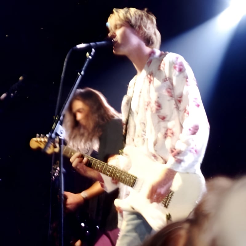 Kurt Cobain performs in a white top at the 1992 MTV Video Music Awards