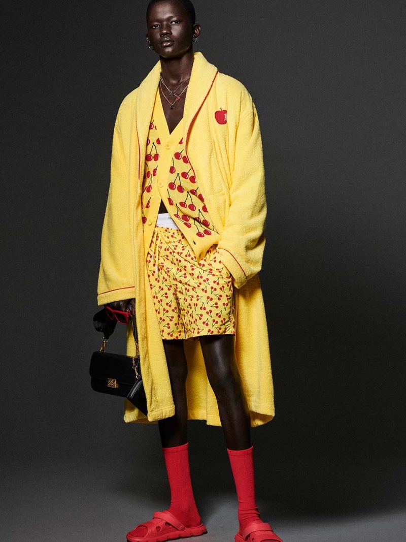 Manyuon Deng stands out in a yellow and red cherry print outfit for Benetton's spring-summer 2023 campaign. 