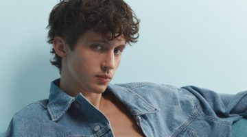 Troye Sivan sports a relaxed denim jean jacket with jeans for Calvin Klein's Pride campaign.