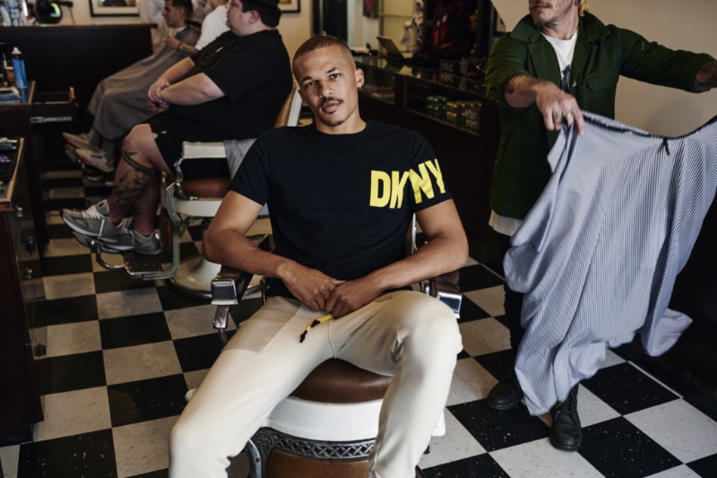Stopping by the barbershop for a touchup, Khalil Ghani stars in DKNY's spring-summer 2023 campaign.