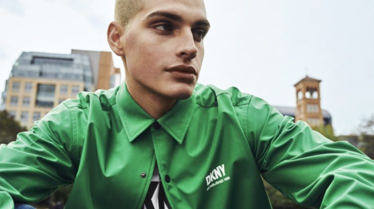 Cameron Porras sports a green coach jacket for DKNY's spring-summer 2023 campaign.