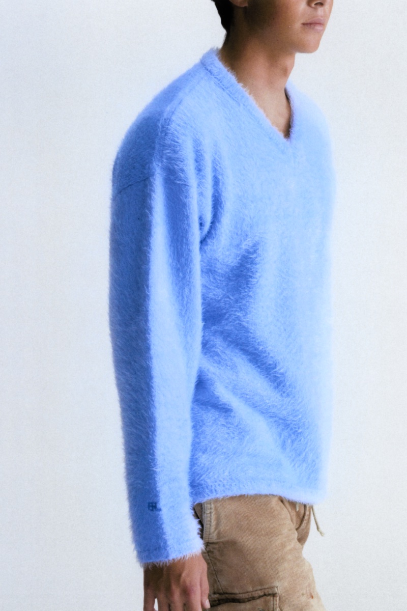 ERL offers an exclusive Mytheresa brushed sweater in baby blue. 
