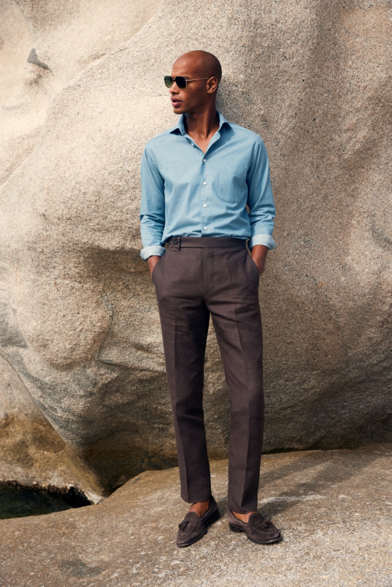 Donning a chic, timeless look, Sacha M'Baye dons a classic shirt for Eton's spring-summer 2023 campaign.