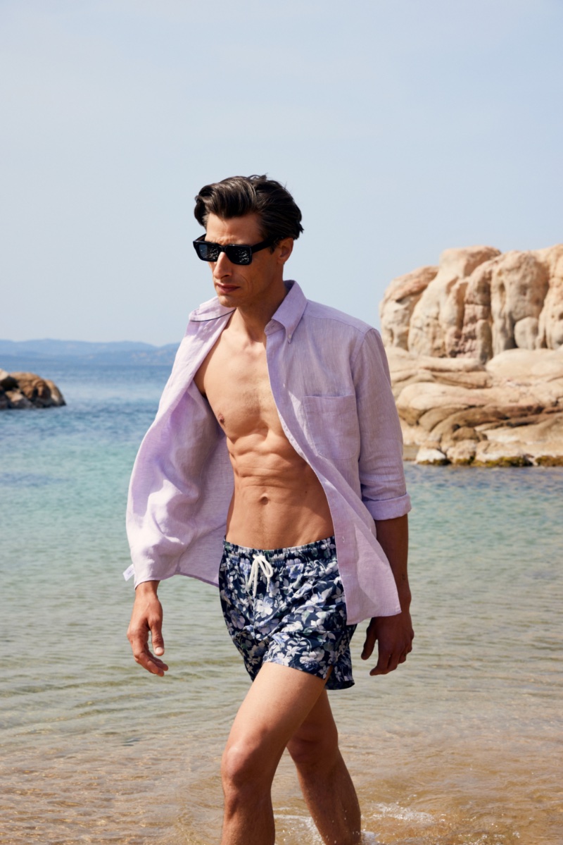 Model Jonas Mason sports a lilac-colored linen shirt for Eton's spring-summer 2023 campaign. » Eton's New Collection Celebrates the Beauty of Sardinia Model Jonas Mason sports a lilac-colored linen shirt for Eton's spring-summer 2023 campaign.