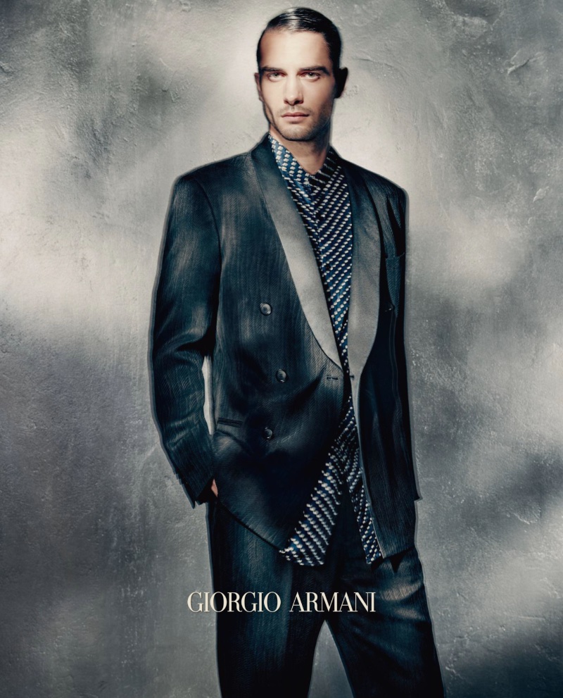 Donning an elegant suit, Aleksandar Rusic stars in Giorgio Armani's spring-summer 2023 campaign for men.