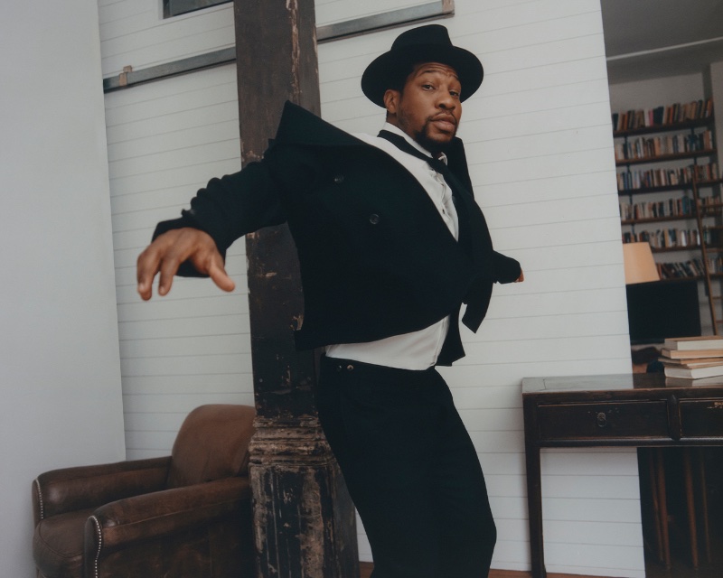 Going formal, Jonathan Majors is pictured in a Gabriela Hearst double-breasted blazer with a Brioni dress shirt, and Brunello Cucinelli tie.