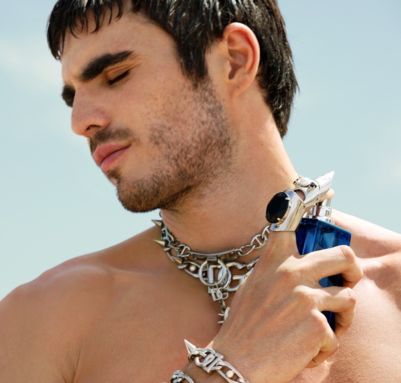 Dolce & Gabbana advertising model Diego Villarreal poses with a bottle of K by Dolce & Gabbana eau de parfum campaign. 
