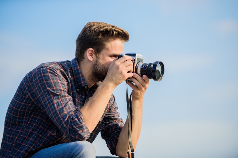 Man with Digital Camera Taking Photo Man with Digital Camera Taking Photo