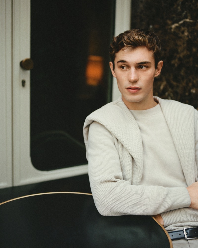 Kit Butler layers in neutral-colored sweaters from Mango's range of men's essentials. 