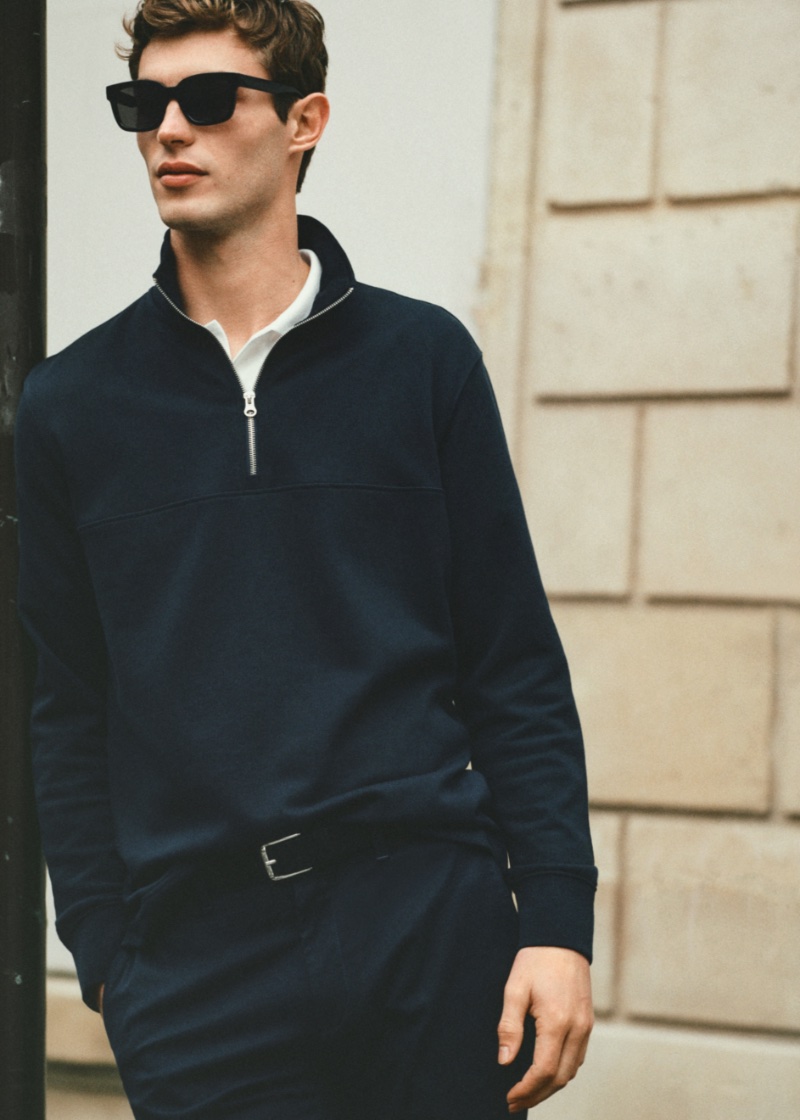 A smart vision, Kit Butler dons a monochrome look, which features a 3/4 pullover. 