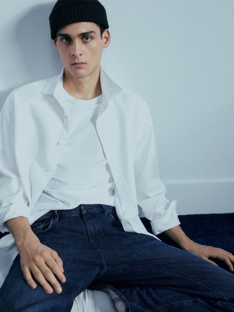 Donning a classic white shirt, Ludwig Wilsdorff also sports Massimo Dutti's regular-fit stonewash jeans. 