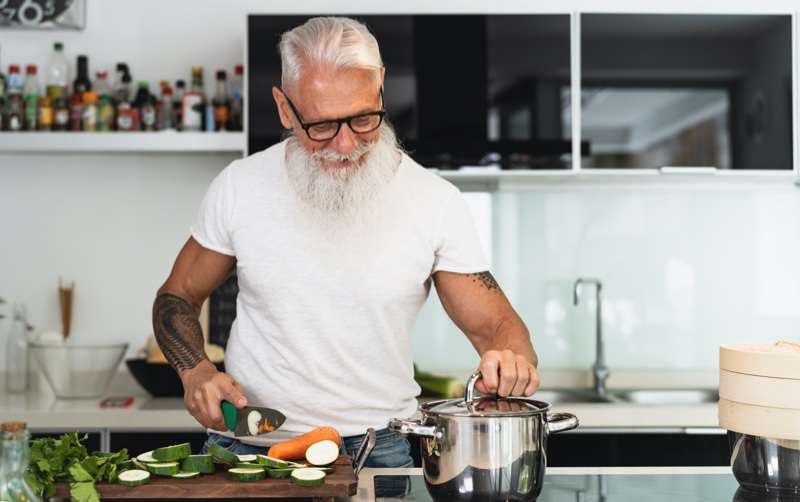 Older Man Cooking Vegetables