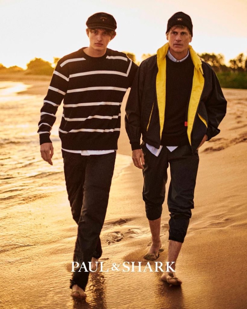 Walking along the beach, Mark Vanderloo Jr. and Mark Vanderloo don nautical style for Paul & Shark's spring-summer 2023 campaign.