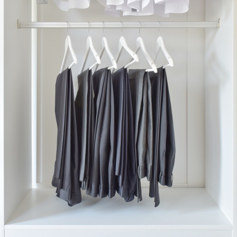 Slacks Hanging in Closet