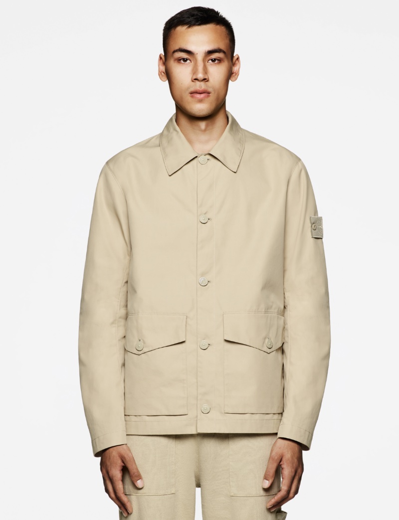 Tien Lebon wears a Stone Island Ghost Piece buttoned jacket in beige. » Modern Camouflage: Stone Island Ghost Pieces Collection Tien Lebon wears a Stone Island Ghost Piece buttoned jacket in beige.