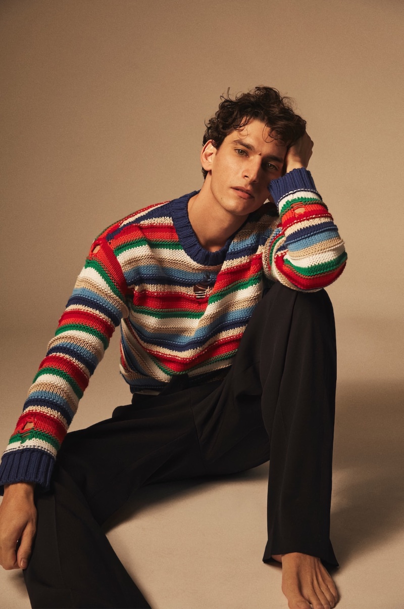 Thibaud Charon wears a striped Dsquared2 sweater. 