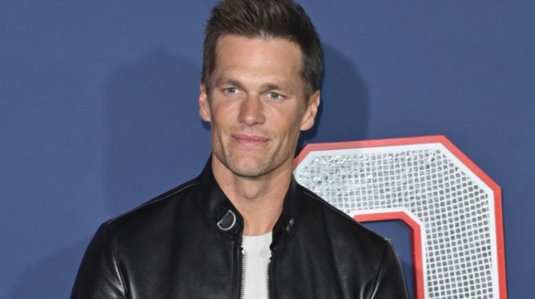 Tom Brady makes a sleek statement in a Tom Ford nappa plonge café racer jacket at the Los Angeles premiere of 80 for Brady.
