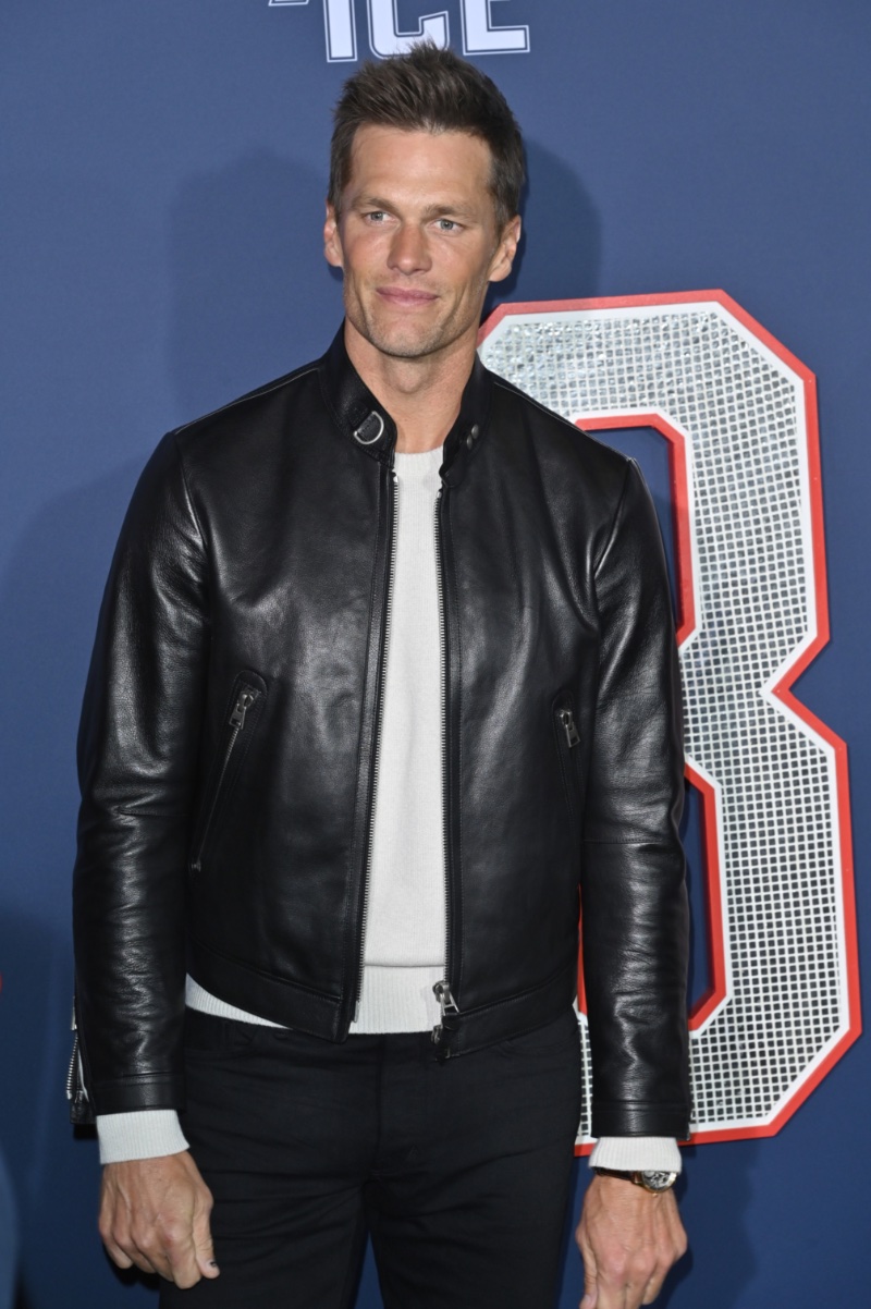 Tom Brady makes a sleek statement in a Tom Ford nappa plonge café racer jacket at the Los Angeles premiere of 80 for Brady.
