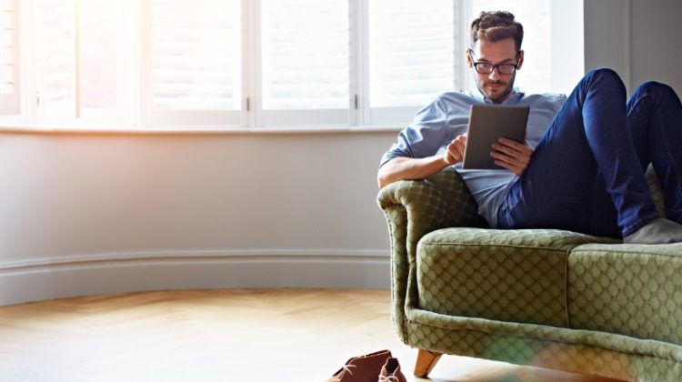 Home Renovation Man on Tablet Empty Living Room Couch