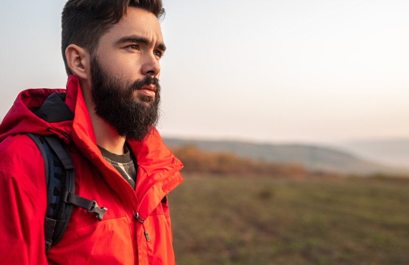 Man Hiking Red Hooded Jacket Buying Sportswear » Buying Sportswear: Common Mistakes to Avoid Man Hiking Red Hooded Jacket Buying Sportswear