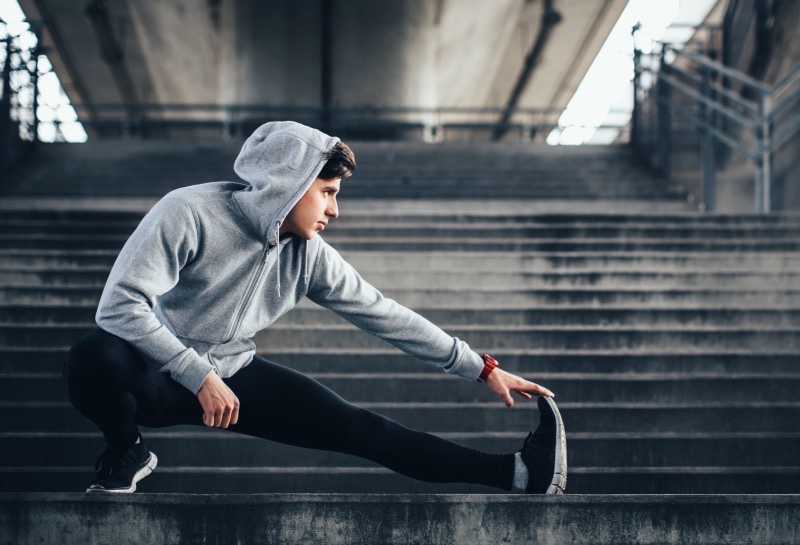 Man Stretching Workout Wear