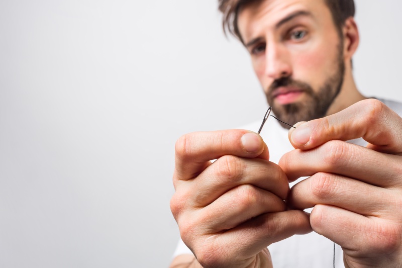 Man Threading Needle » Clothing Care: Maintaining Your Stylish Wardrobe Man Threading Needle