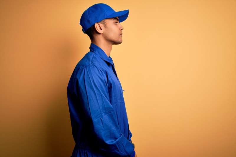 Man Wearing Blue Snapback Cap