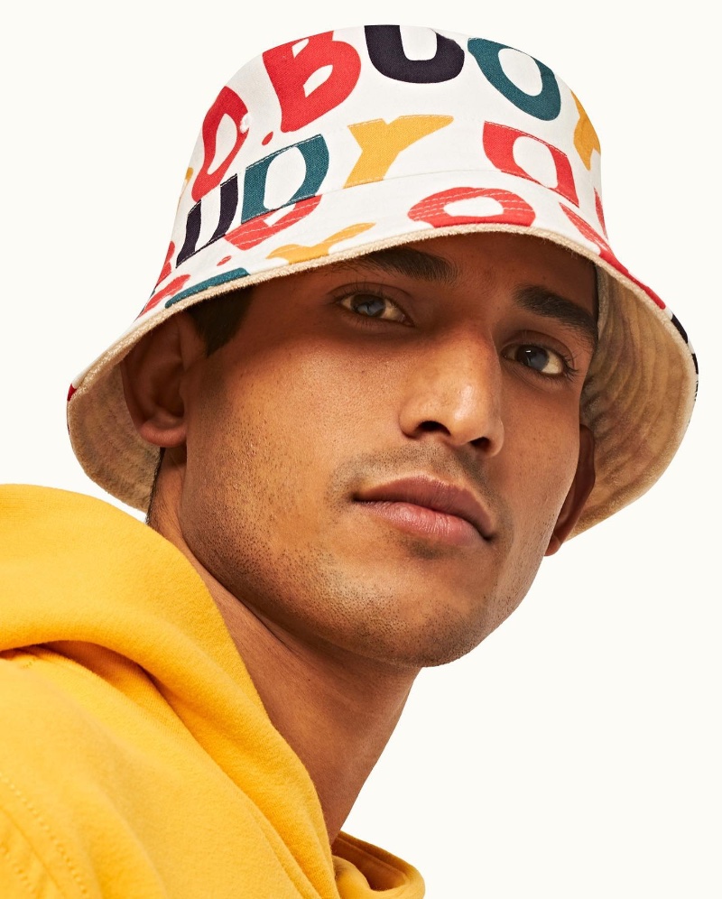Model Pranav Bhargav rocks a colorful print bucket hat from Orlebar Brown's O.BUOY capsule collection. » Ocean Chic: Dive Into Orlebar Brown's O. BUOY Capsule Model Pranav Bhargav rocks a colorful print bucket hat from Orlebar Brown's O.BUOY capsule collection.