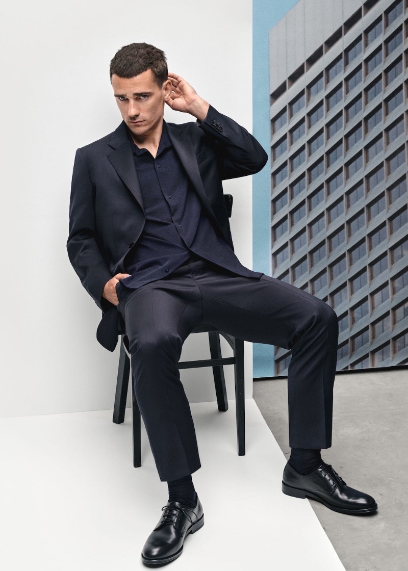 Antoine Griezmann wears a slim-fit virgin wool suit for Mango's spring-summer 2023 campaign.