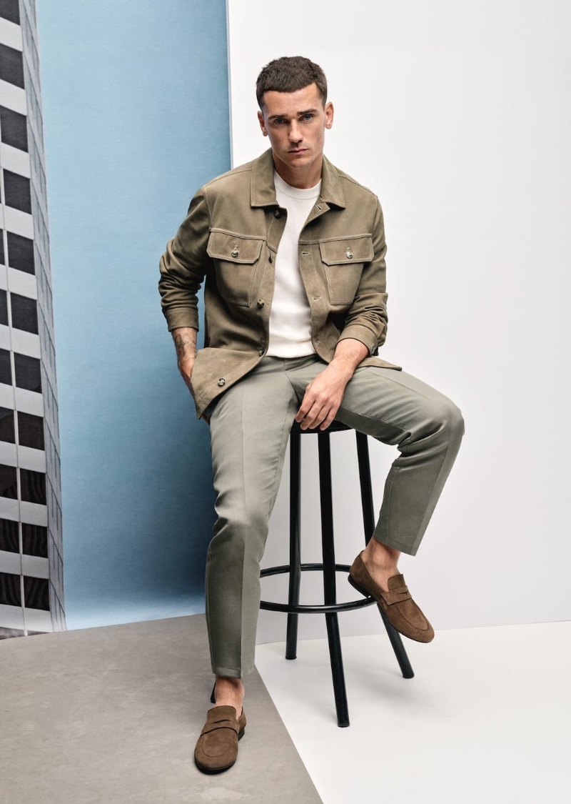 In front and center, Antoine Griezmann wears a leather jacket and slim-fit 100% linen pants for Mango's spring-summer 2023 campaign.