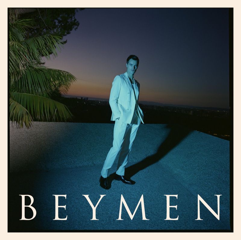 Donning a white suit, Parker van Noord appears in Beymen's spring-summer 2023 campaign.