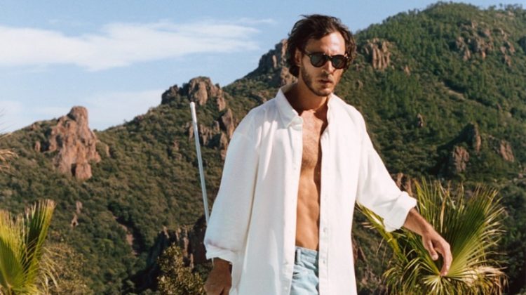 Cleaning the pool, Pierre-Benoit Talbourdet models an open white shirt with tapered jeans from Closed.