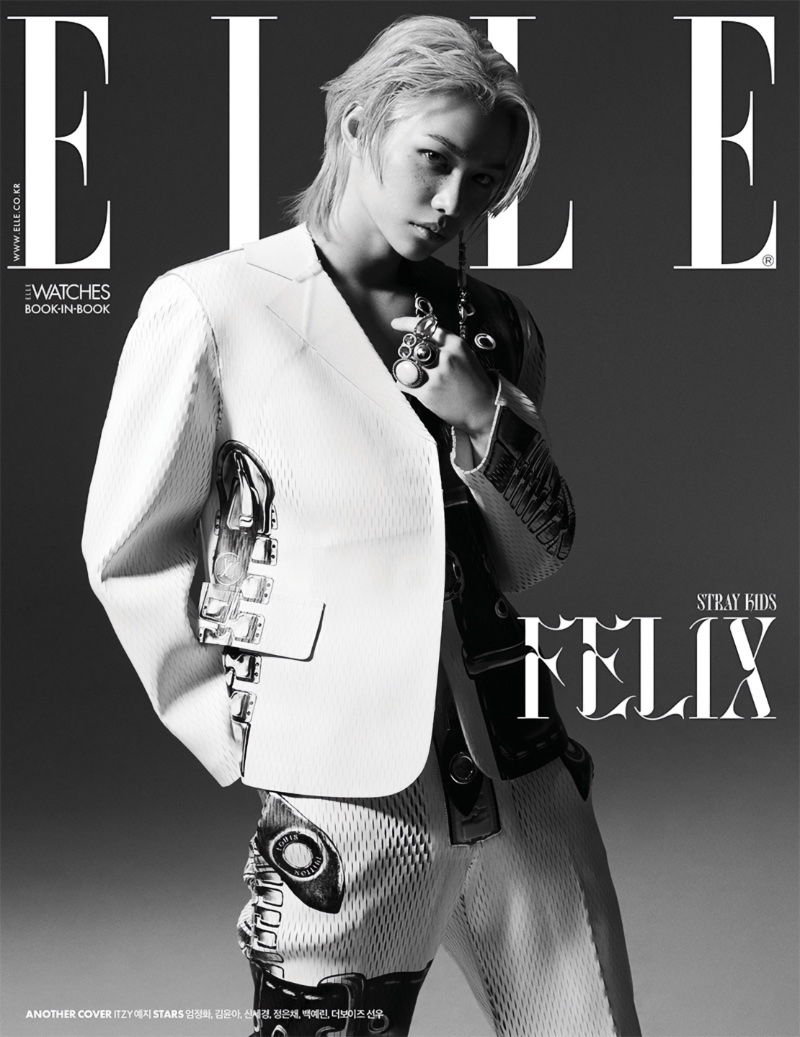 Felix of Stray Kids fame sports a perforated Louis Vuitton suit in white for the May 2023 cover of Elle Korea. 