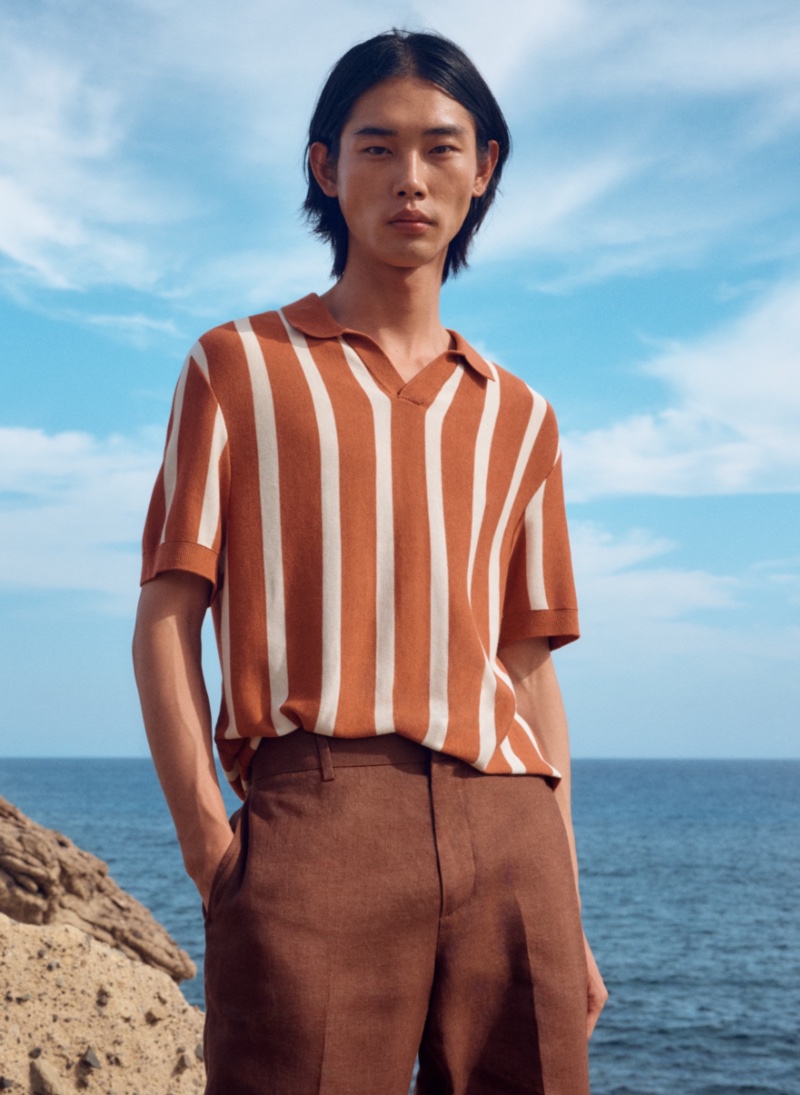 Taemin Park wears a striped knit polo with regular-fit linen suit pants.