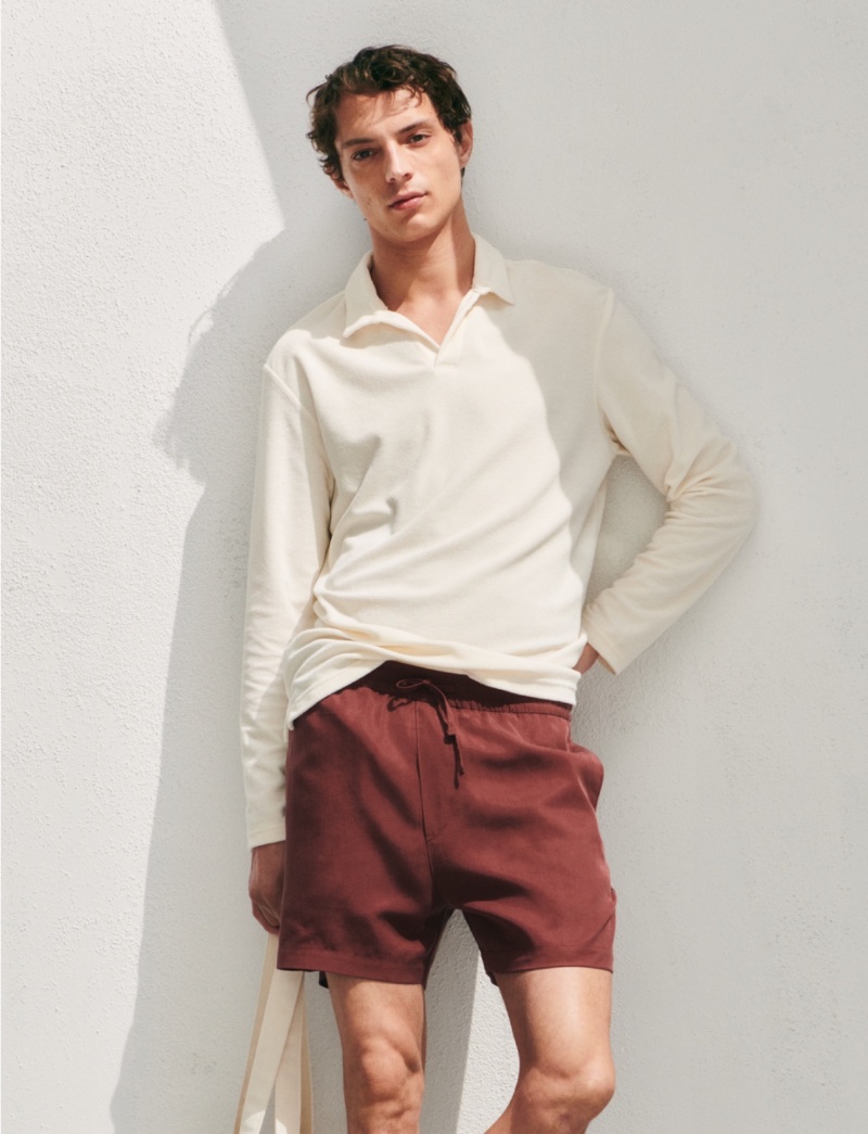 Andrea Quaranta rocks drawstring shorts with a long-sleeve polo.