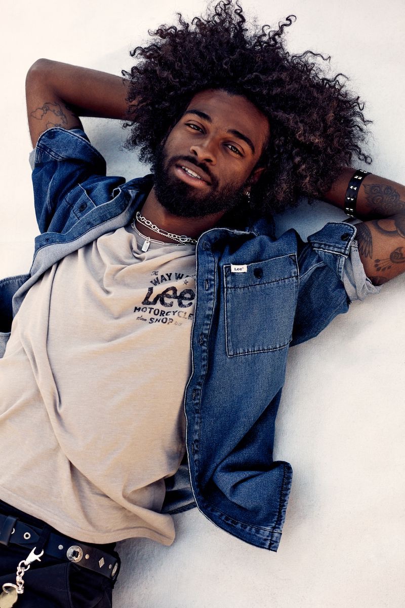 Skater Carl Aikens sports a denim shirt and tee for Lee's spring 2023 campaign.