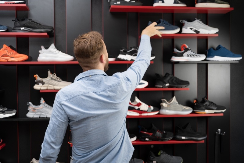 Man Looking at Sneakers