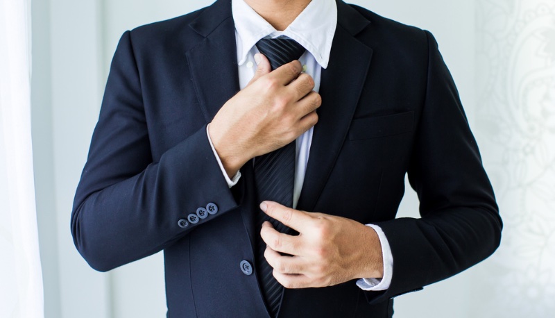 Man Suit Adjusting Tie » 5 Formal Attire Faux Pas: How to Avoid Them Man Suit Adjusting Tie
