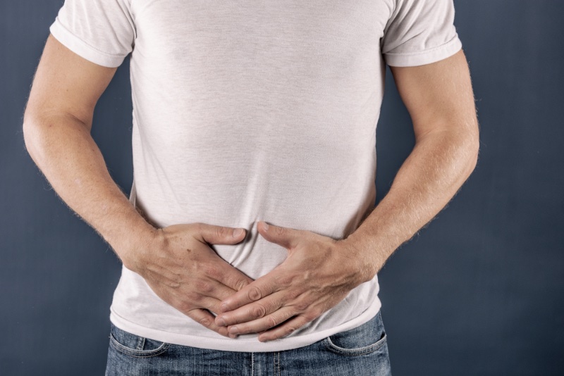 Man Touching Abdomen Man Touching Abdomen