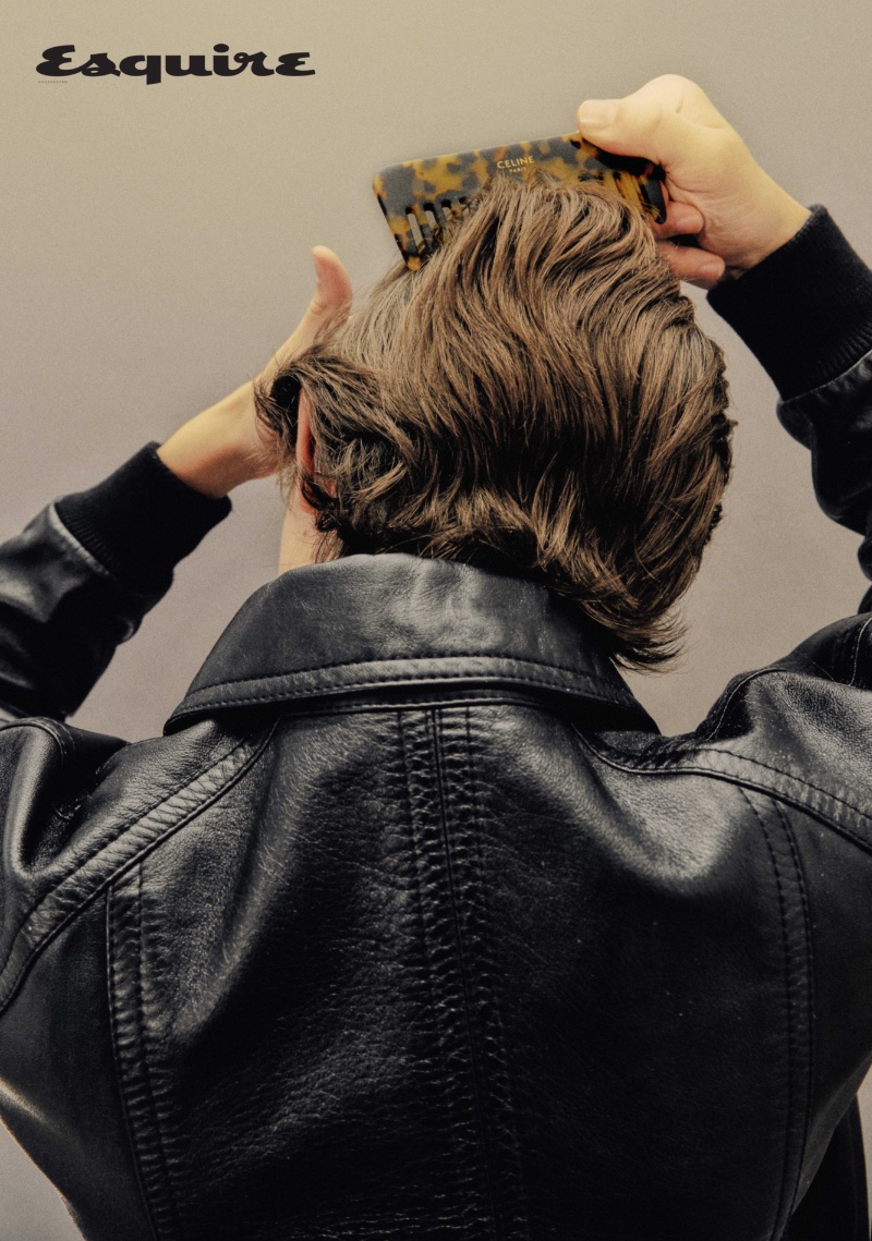 Raphael Luce wears a Celine Homme leather jacket. 