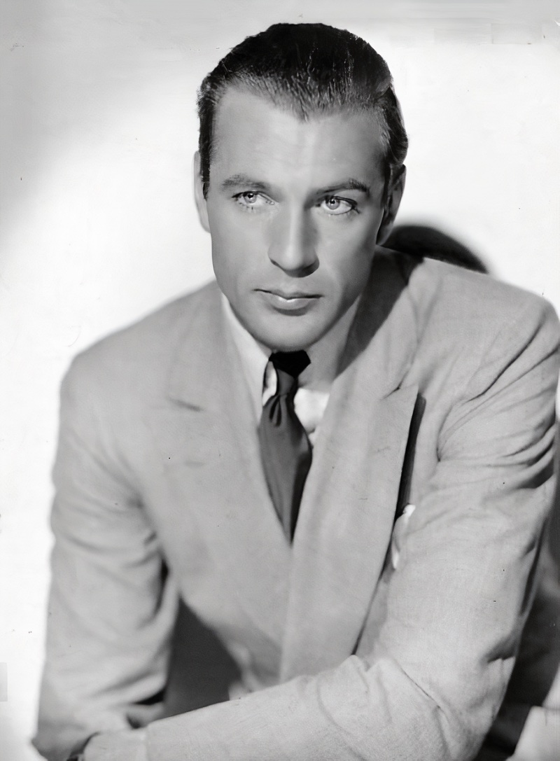 Gary Cooper wears a double-breasted blazer in a 1936 publicity photo for the film Morocco. 