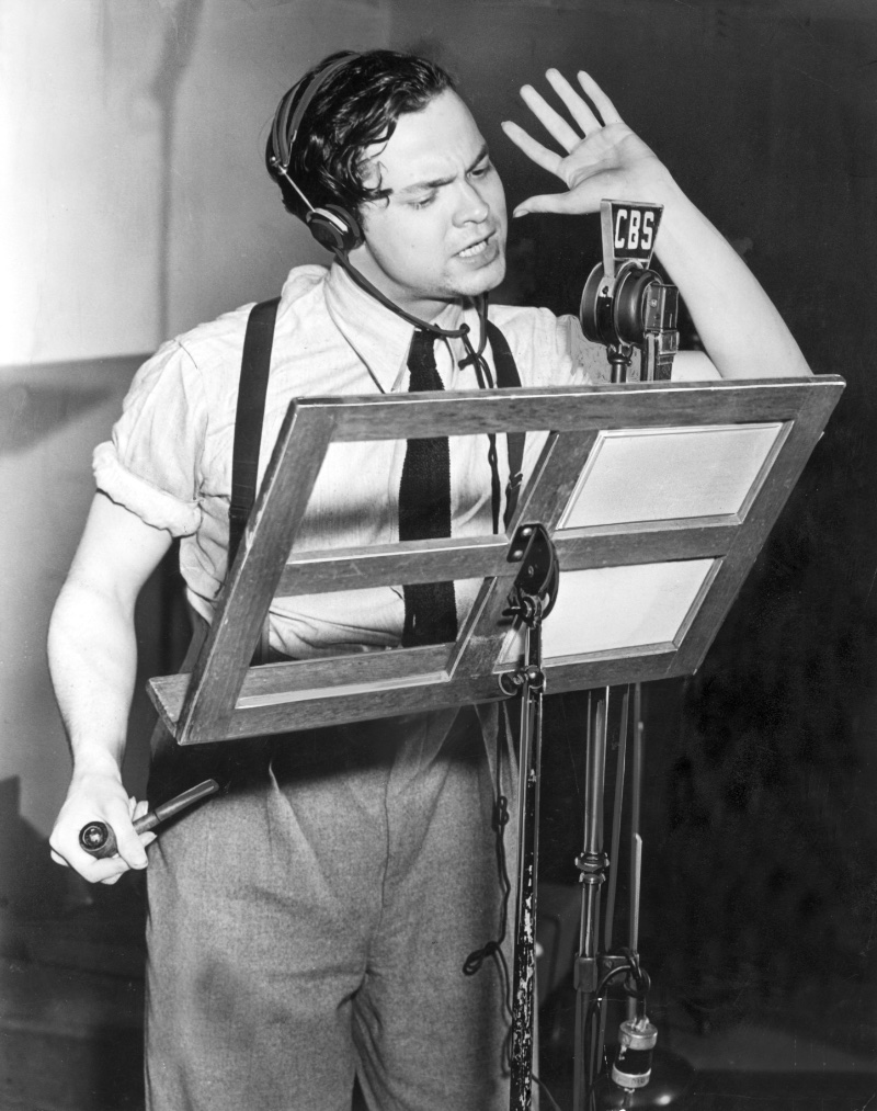 Orson Welles dons suspenders and a tie with a shirt and pleated trousers at a 1939 CBS studio appearance to direct The Mercury Theatre on the Air. 